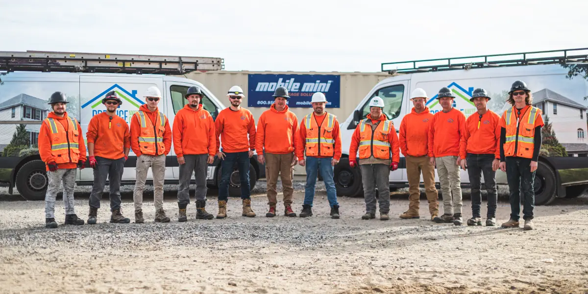The Prestige NWest crew in front of company vans